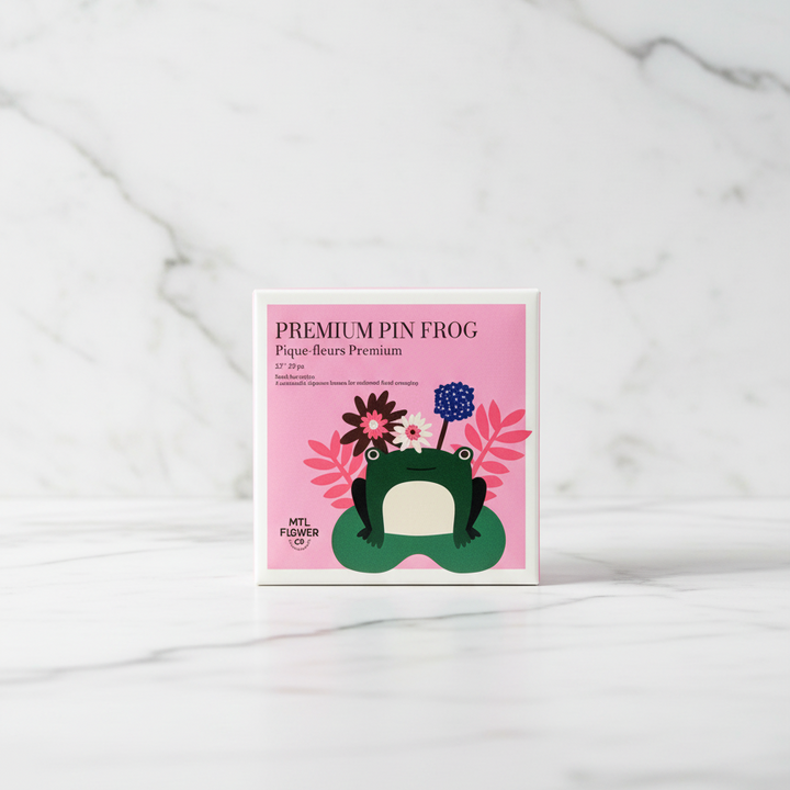 Product packaging with a frog design on a marble background